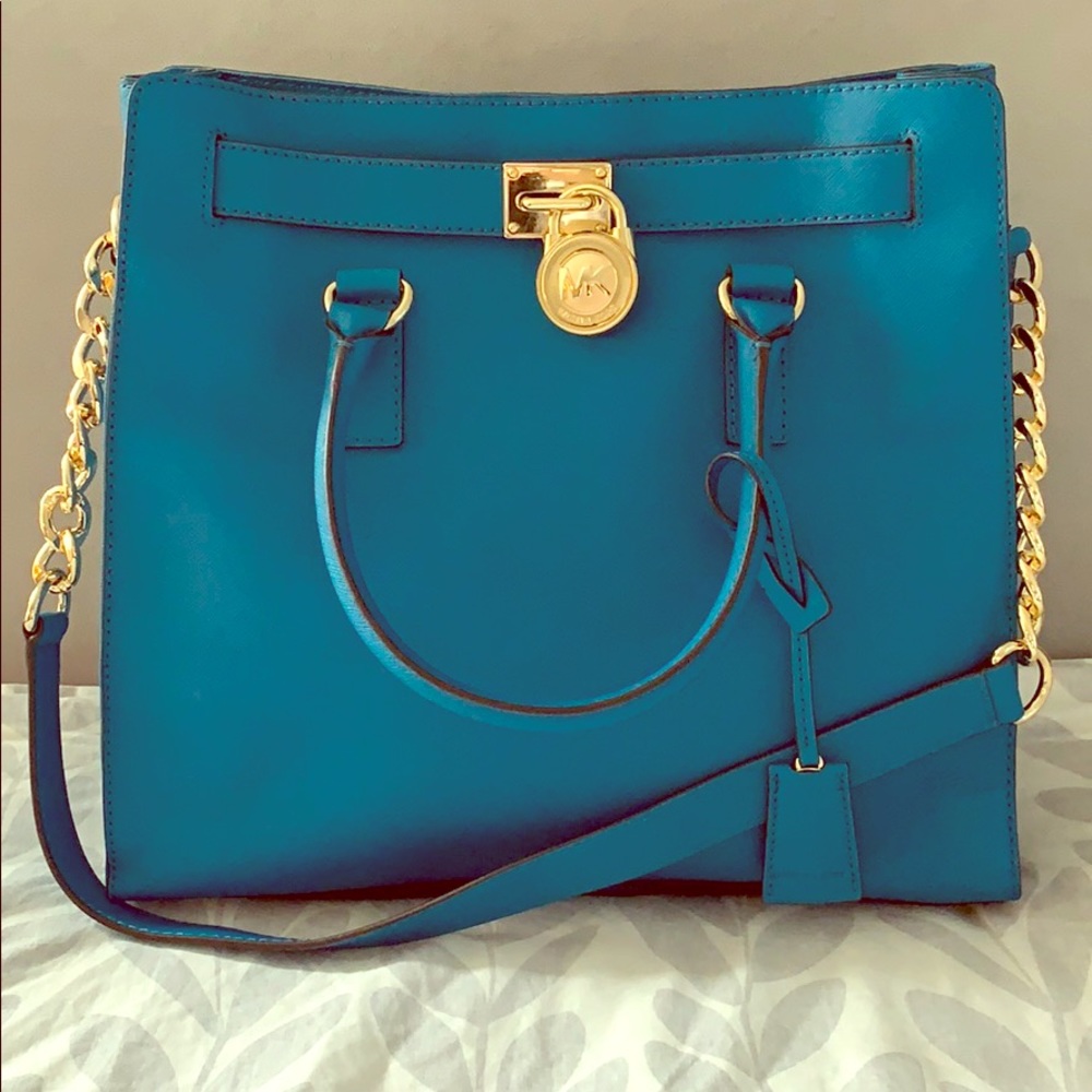 Teal Michael kors bag with gold hardware